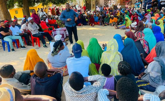 African community members gathered at an NGO outreach event